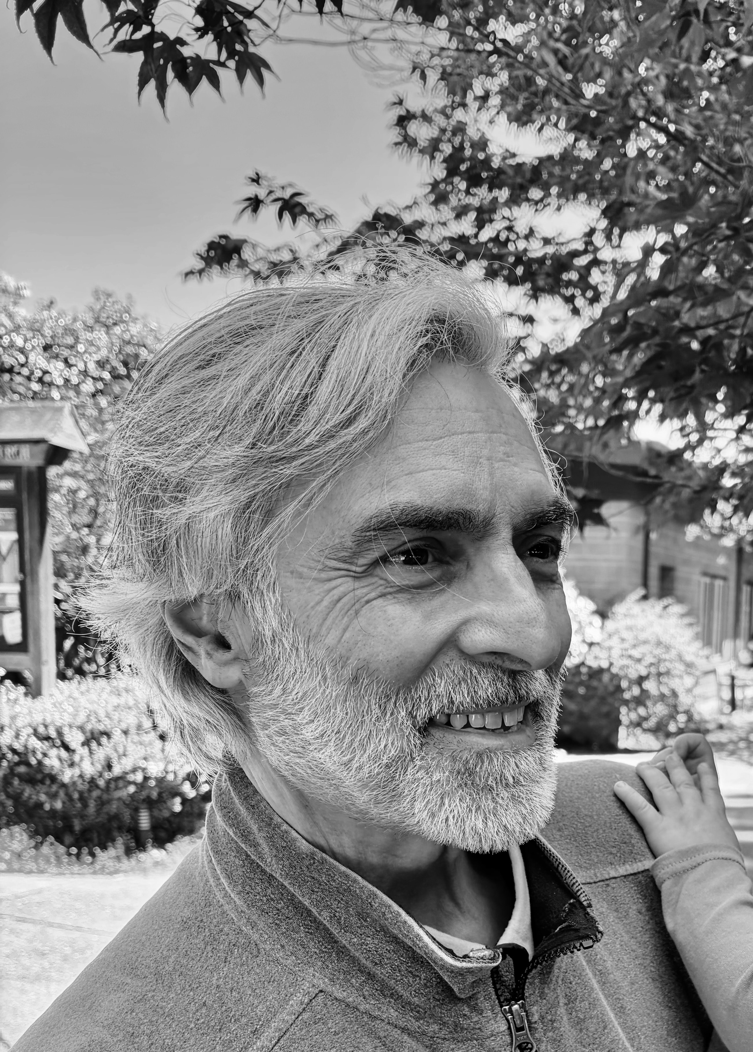 Luis Pine smiling outdoors